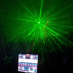 Green laser behind the DJ booth